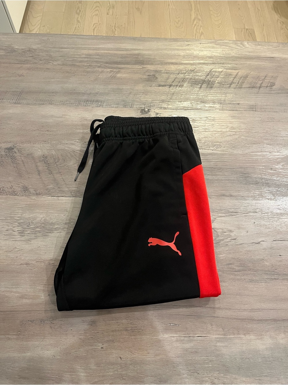 Puma Black Joggers with Red Side Stripe
